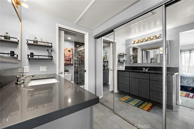 a kitchen with stainless steel appliances granite countertop a sink and cabinets