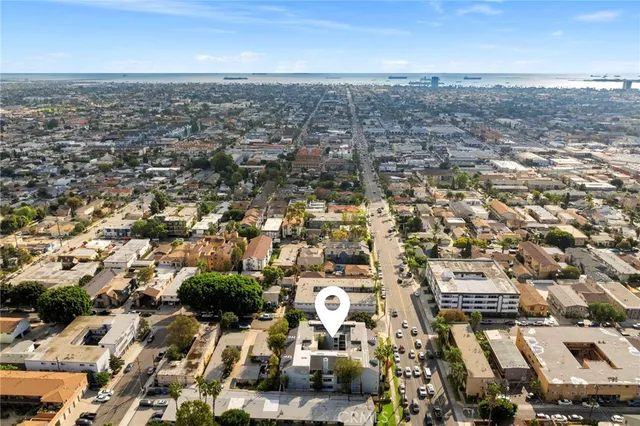 a view of parking garage with cars parked
