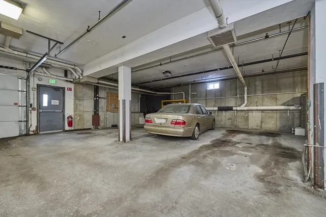 a view of parking garage with cars