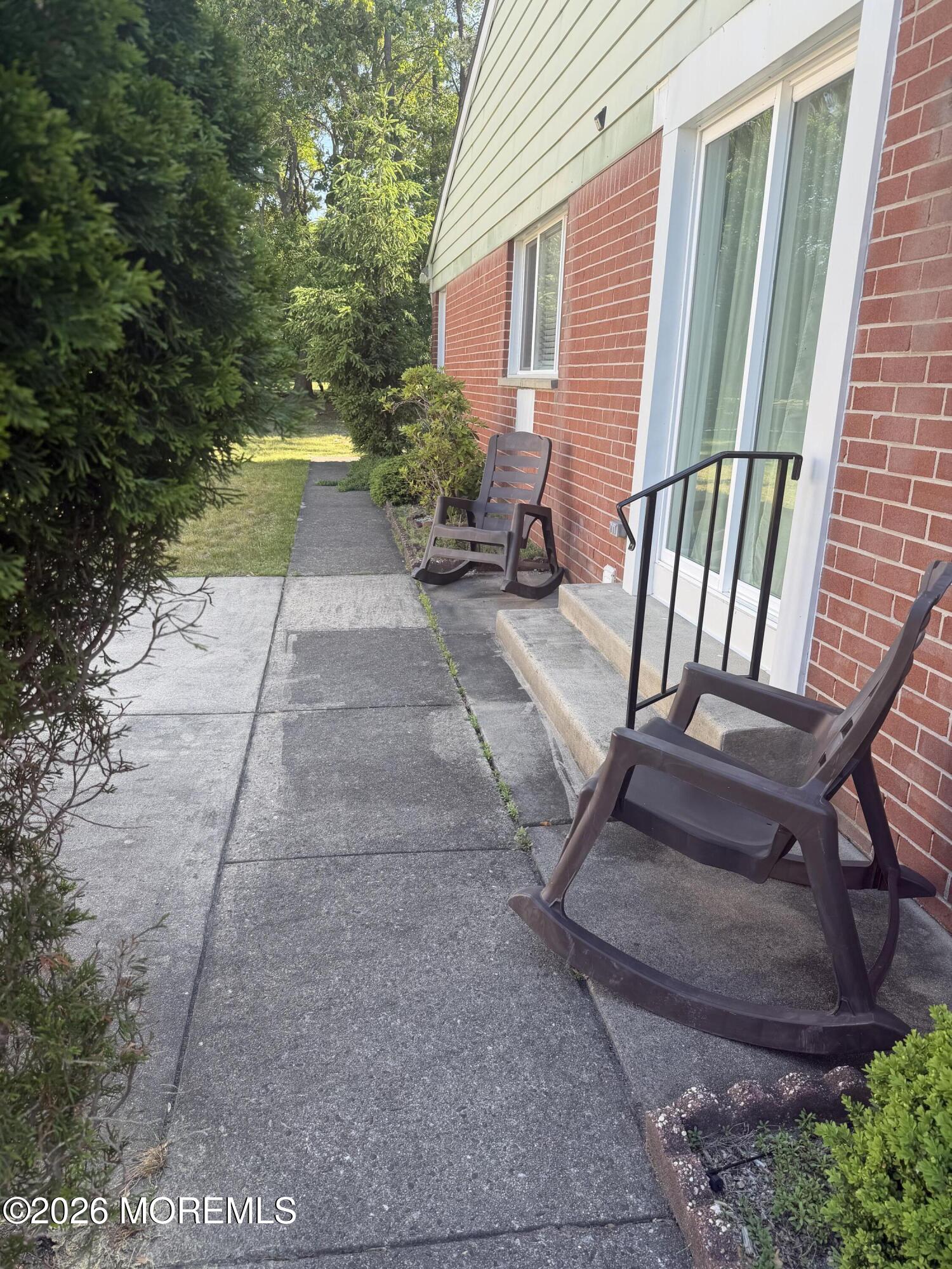 31 Homestead Drive, Unit A Whiting, NJ 08759 - Photo 3 of 23 a view of a backyard with sitting area