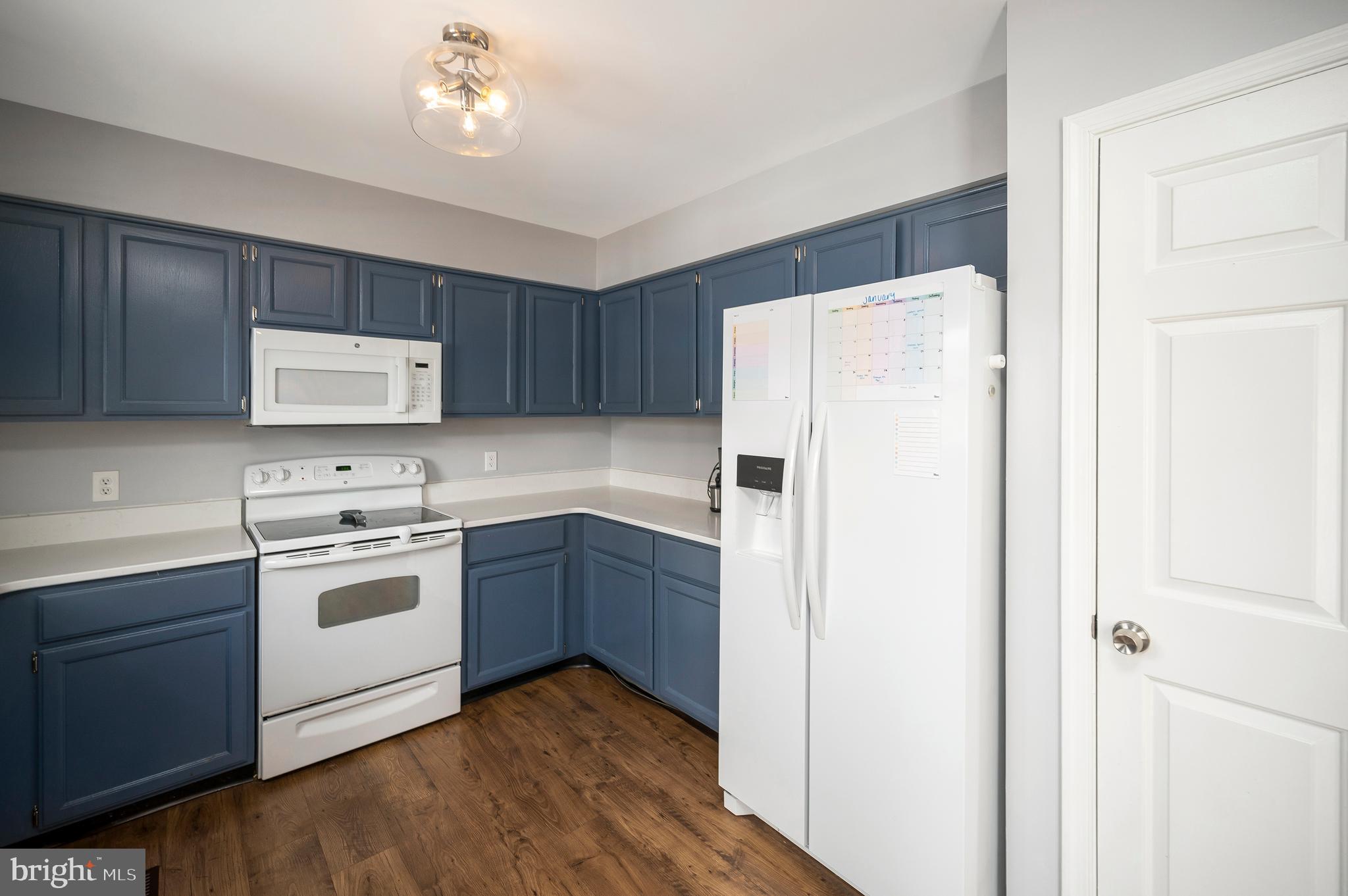 228 Choptank Road Stafford, VA 22556 - Photo 18 of 51 a kitchen with a white cabinets and white appliances