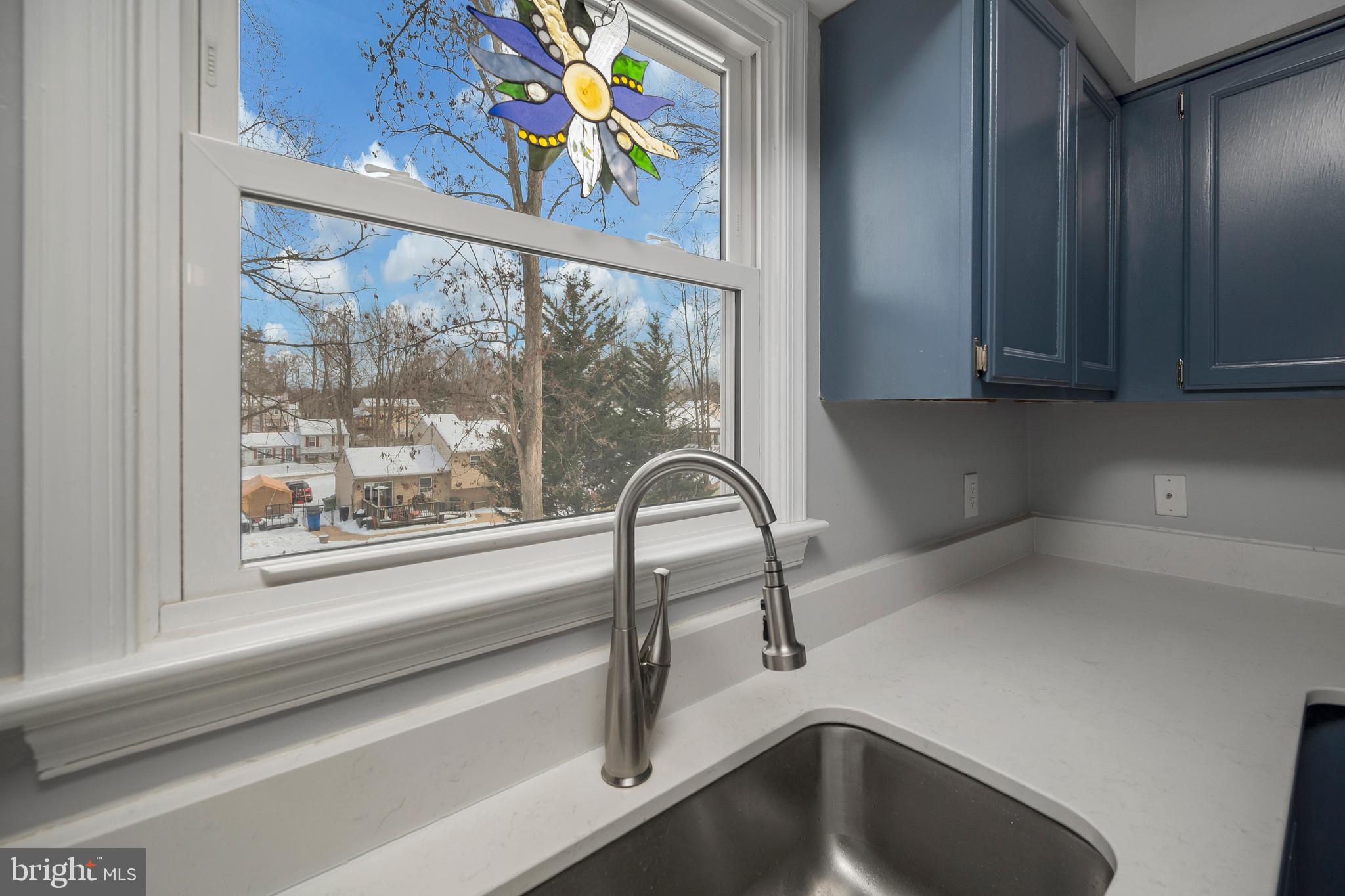 228 Choptank Road Stafford, VA 22556 - Photo 23 of 51 a view of a sink a microwave and window in a kitchen