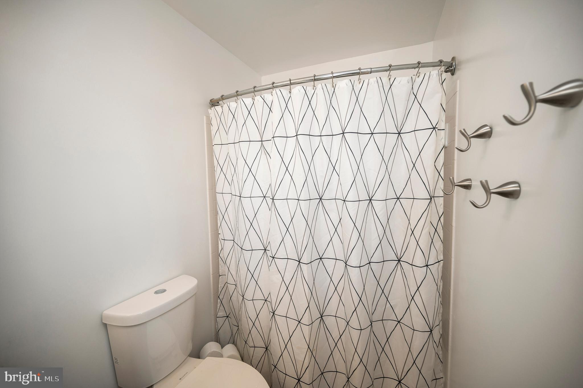 228 Choptank Road Stafford, VA 22556 - Photo 36 of 51 a white toilet sitting next to a white wall