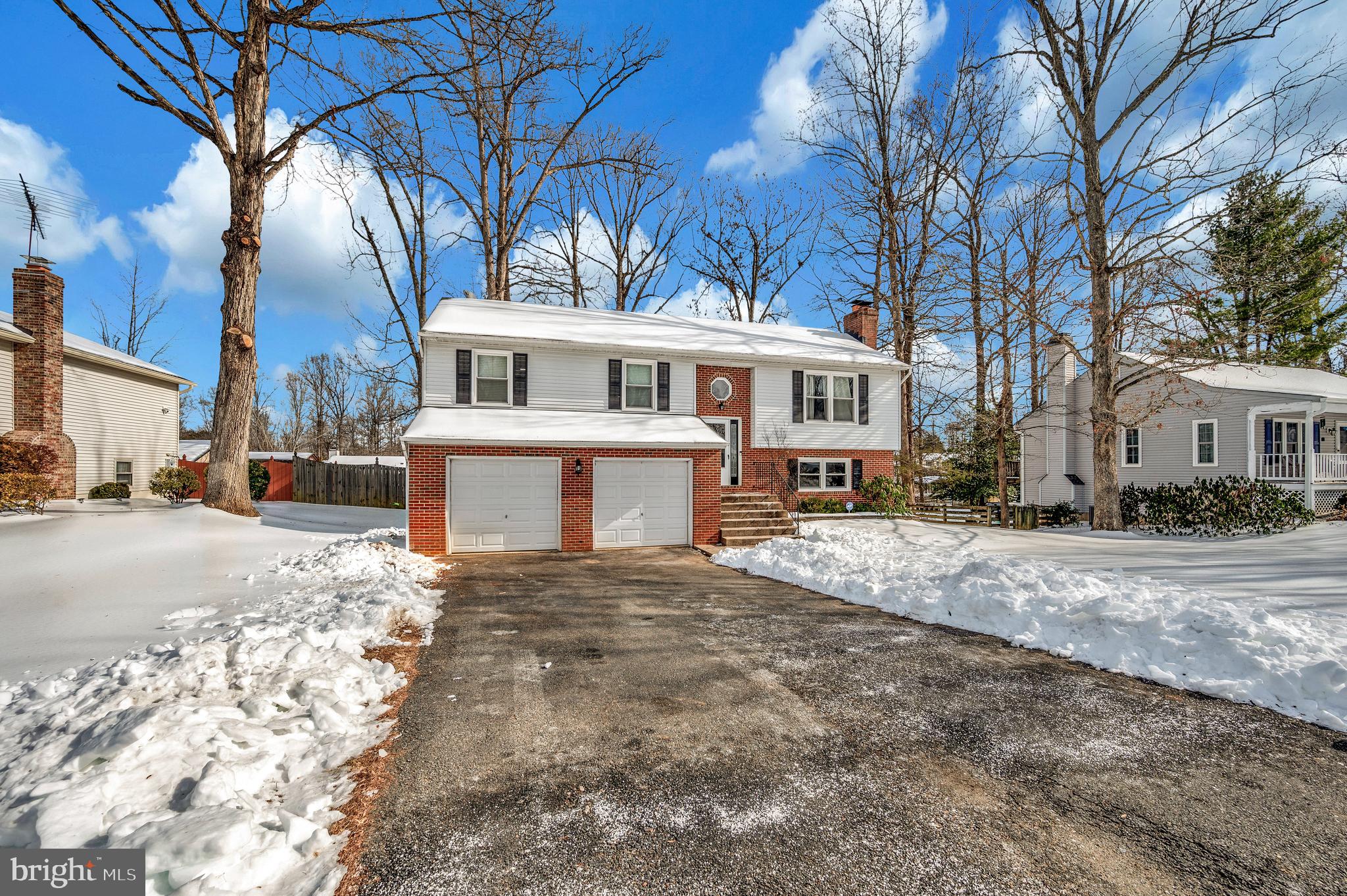 228 Choptank Road Stafford, VA 22556 - Photo 50 of 51 a front view of a house with a yard and garage