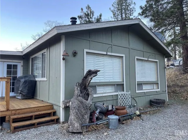 a front view of a house with sitting area