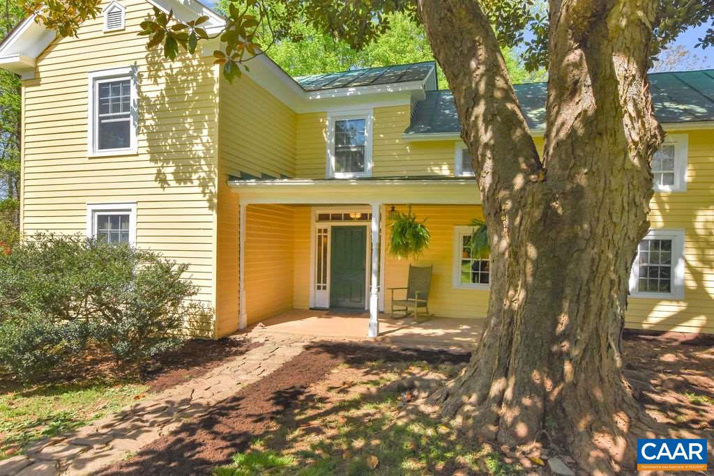 674 Octonia Road Stanardsville, VA 22973 - Photo 1 of 38 a front view of a house with a tree in front