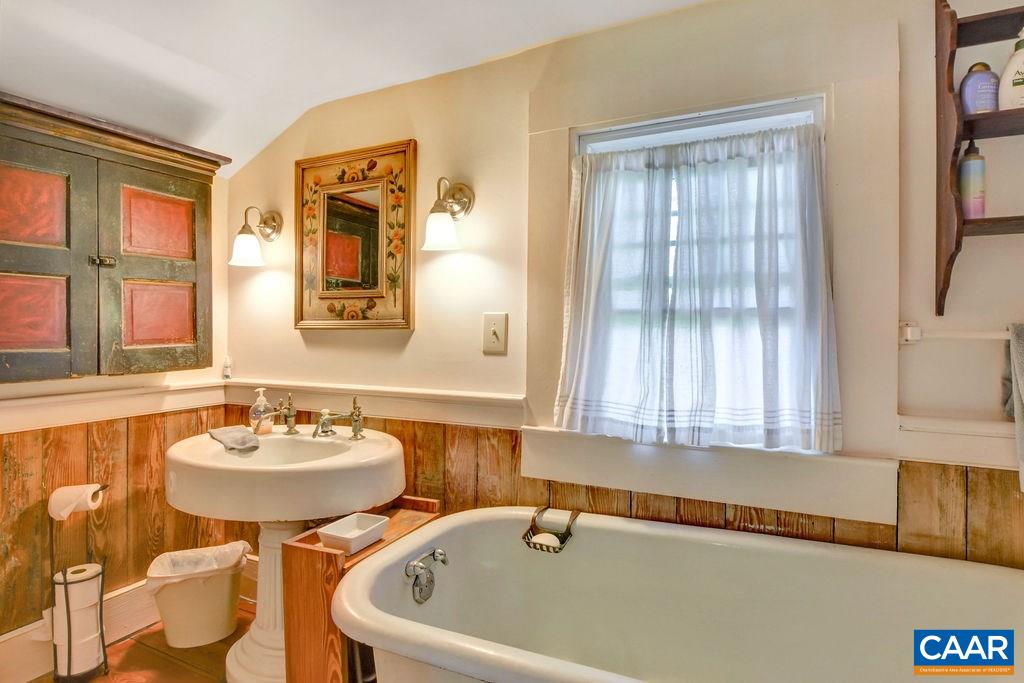 674 Octonia Road Stanardsville, VA 22973 - Photo 20 of 38 a bathroom with a sink and a mirror