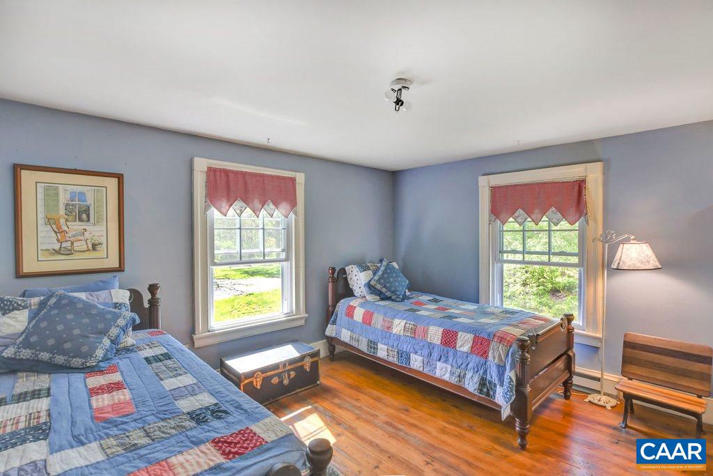 674 Octonia Road Stanardsville, VA 22973 - Photo 22 of 38 a bedroom with a bed and a window