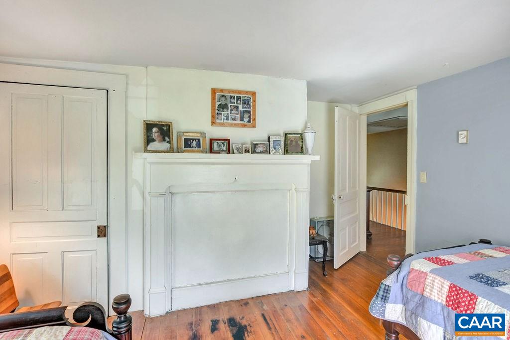 674 Octonia Road Stanardsville, VA 22973 - Photo 23 of 38 a bedroom with a bed and a window
