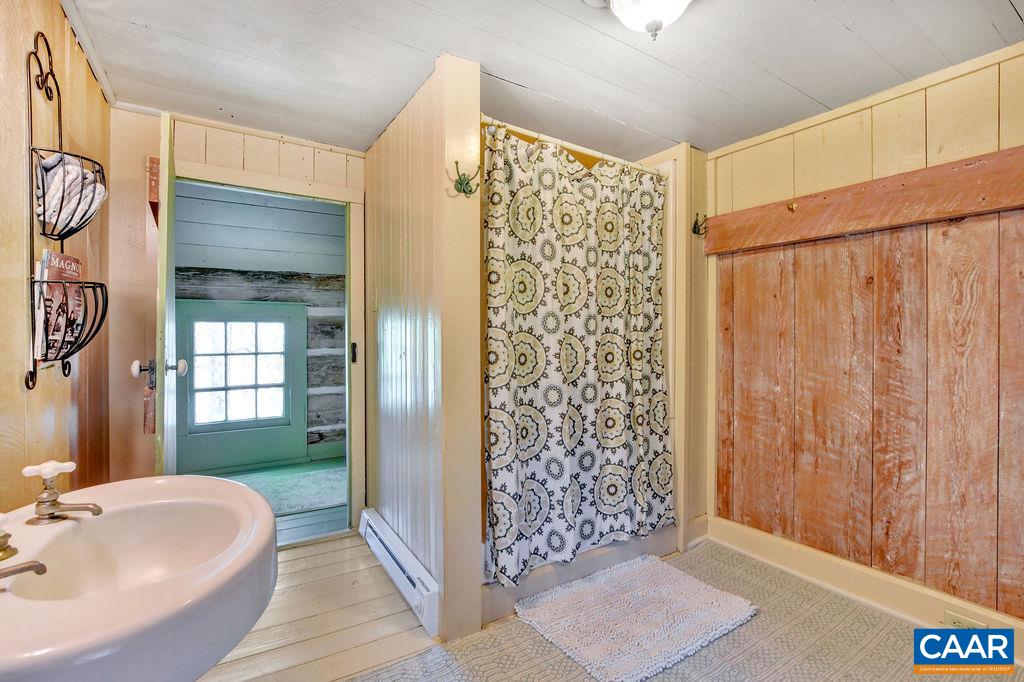 674 Octonia Road Stanardsville, VA 22973 - Photo 28 of 38 a bathroom with a shower and a sink