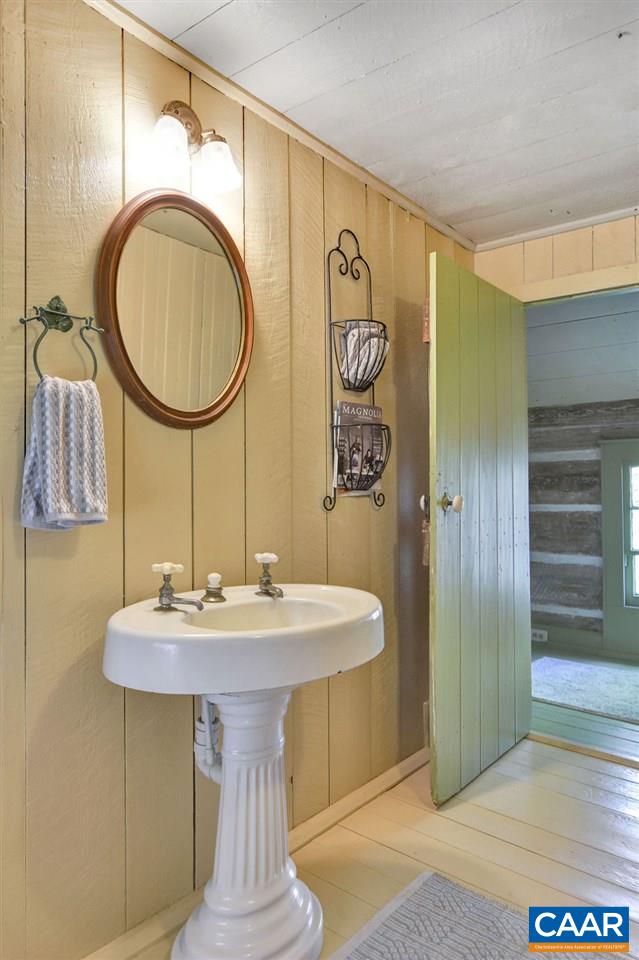 674 Octonia Road Stanardsville, VA 22973 - Photo 29 of 38 a bathroom with a sink a mirror and a shower