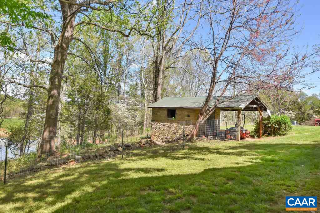 674 Octonia Road Stanardsville, VA 22973 - Photo 35 of 38 a front view of house with yard and trees