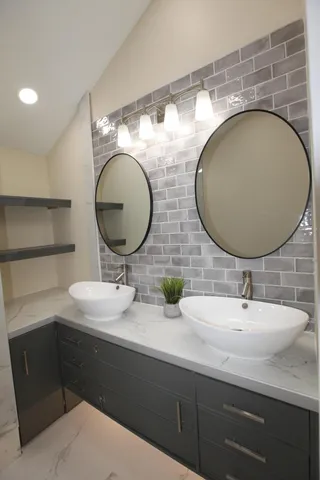 a bathroom with a sink and a mirror