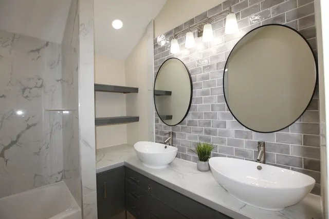 a bathroom with a sink and a mirror
