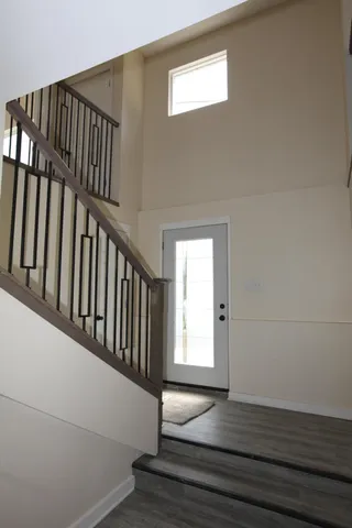 a view of entryway with wooden floor
