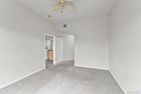 a bathroom with a toilet a sink a tub and mirror