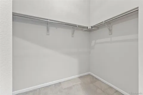 en empty room with sliding door and wooden floor