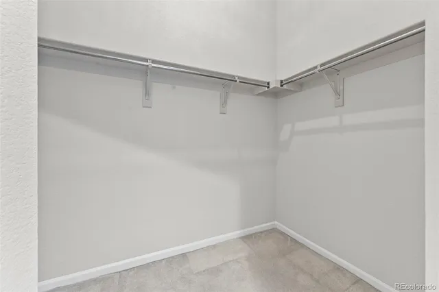 en empty room with sliding door and wooden floor