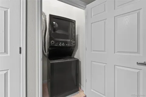 a kitchen with stainless steel appliances granite countertop a sink and a refrigerator
