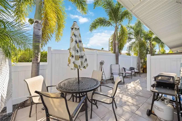a view of a tables and chairs in a patio