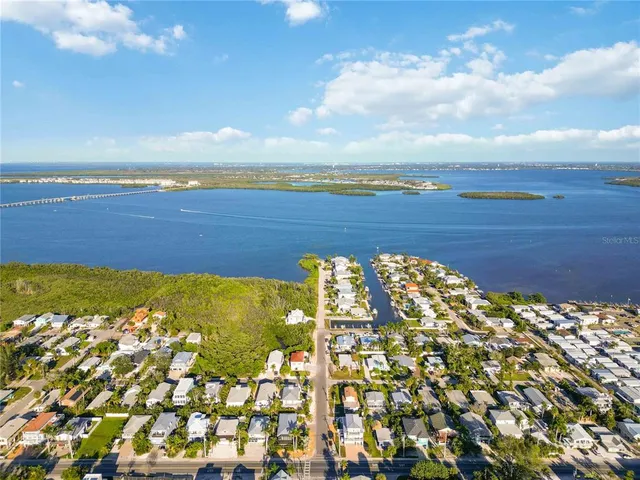 a kitchen with a refrigerator and cabinets
