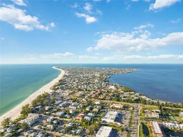 a kitchen with sink cabinets and wooden floor