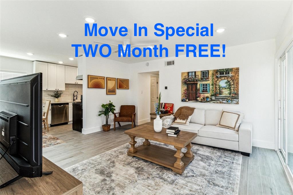1200 East 52nd Street, Unit 210 Austin, TX 78723 - Photo 1 of 13 a living room with furniture a refrigerator and a table