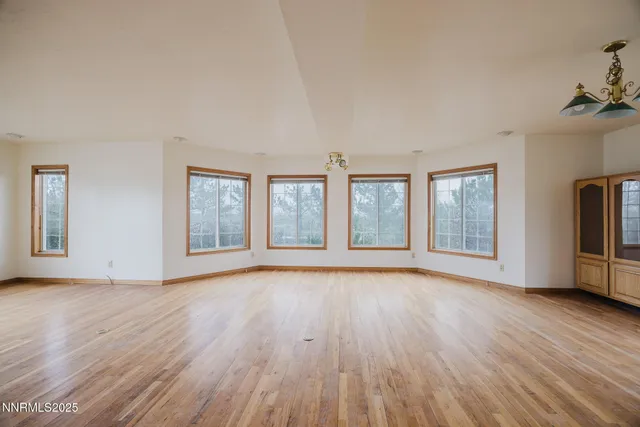 a view of hallway with wooden floor