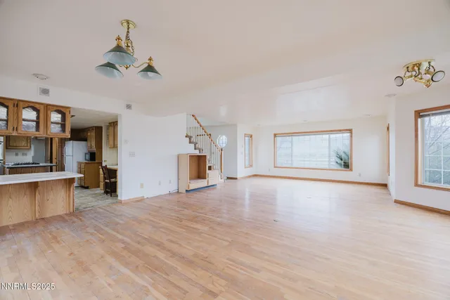 a spacious bathroom with a sink and a mirror