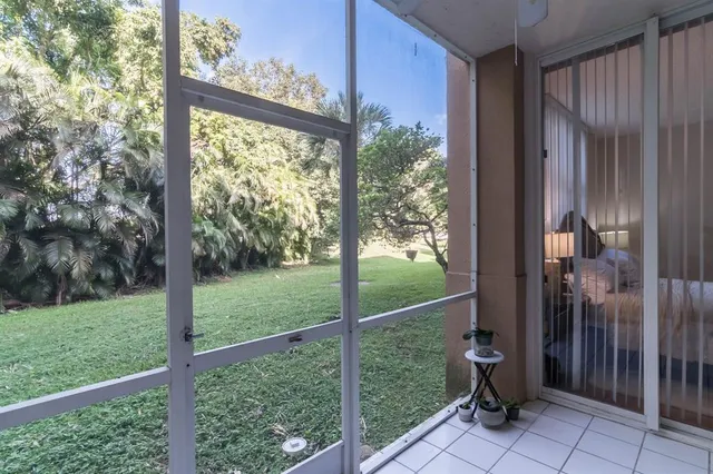 a view of a porch with a yard