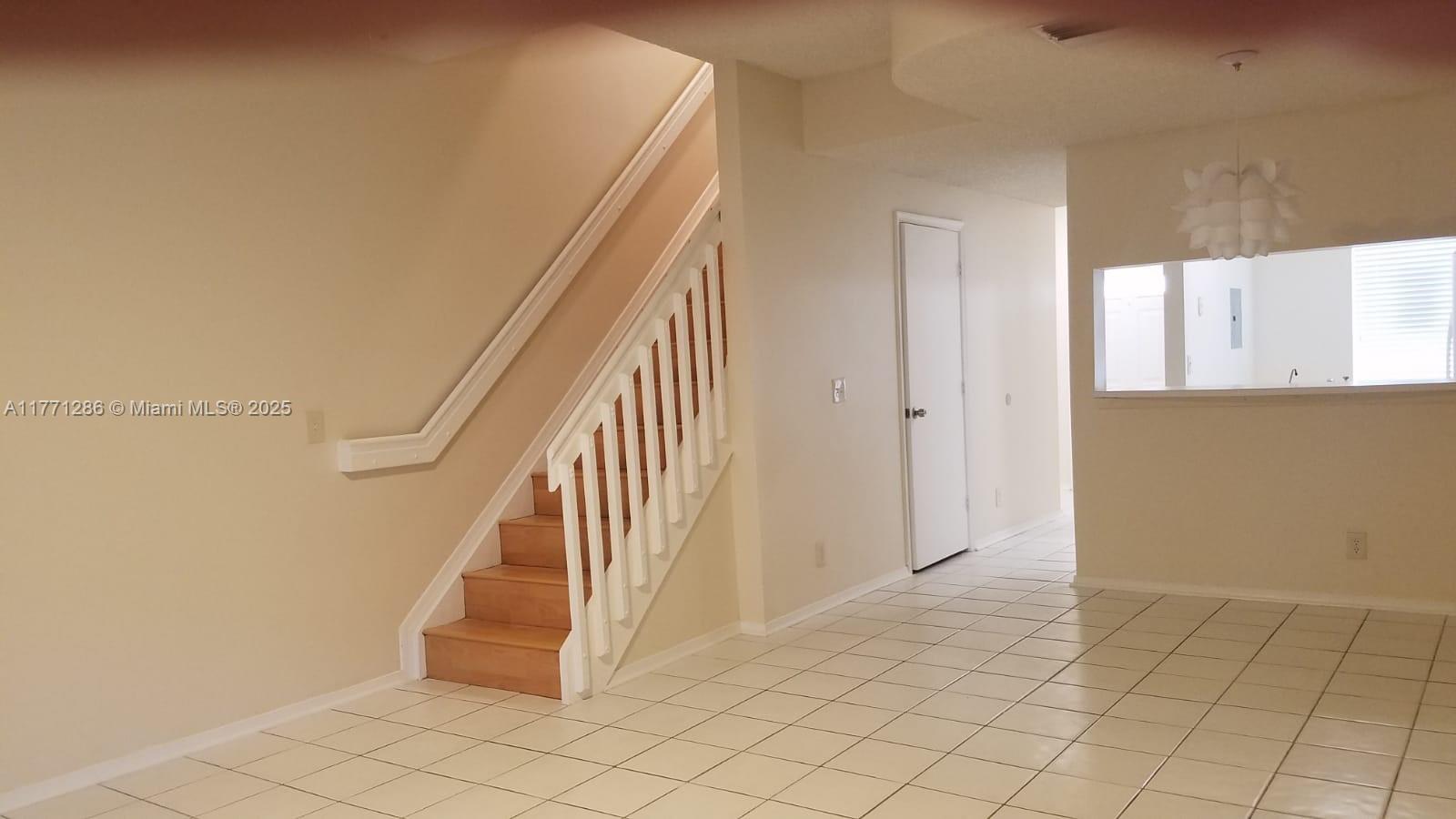 9 Whitehead Circle, Unit 9 Weston, FL 33326 - Photo 11 of 22 a view of entryway and hall with a window