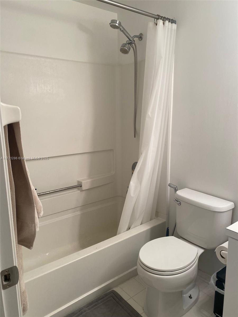 9 Whitehead Circle, Unit 9 Weston, FL 33326 - Photo 16 of 22 a white toilet sitting next to a bath tub