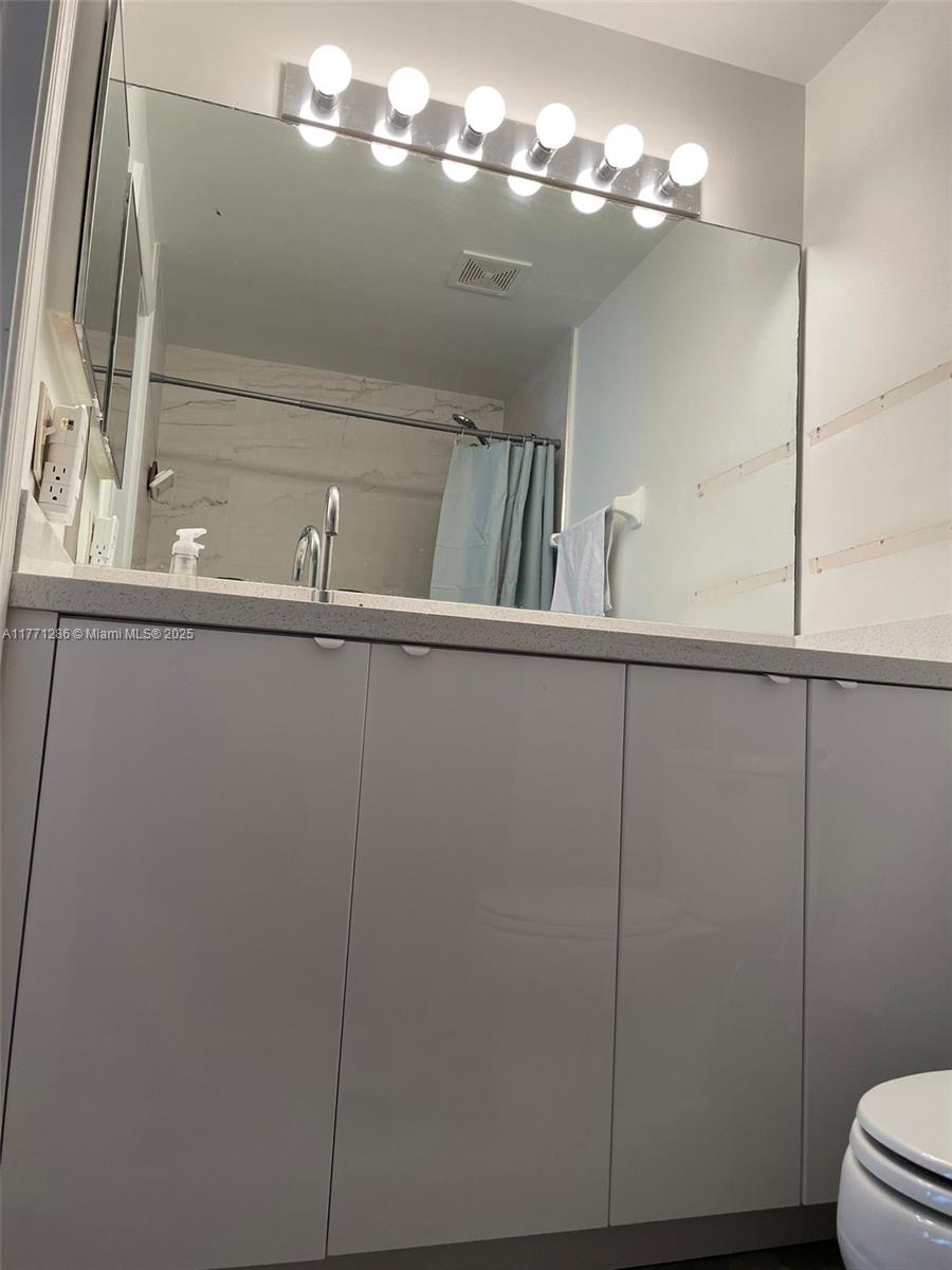 9 Whitehead Circle, Unit 9 Weston, FL 33326 - Photo 17 of 22 a view of a decorative light in a shelf