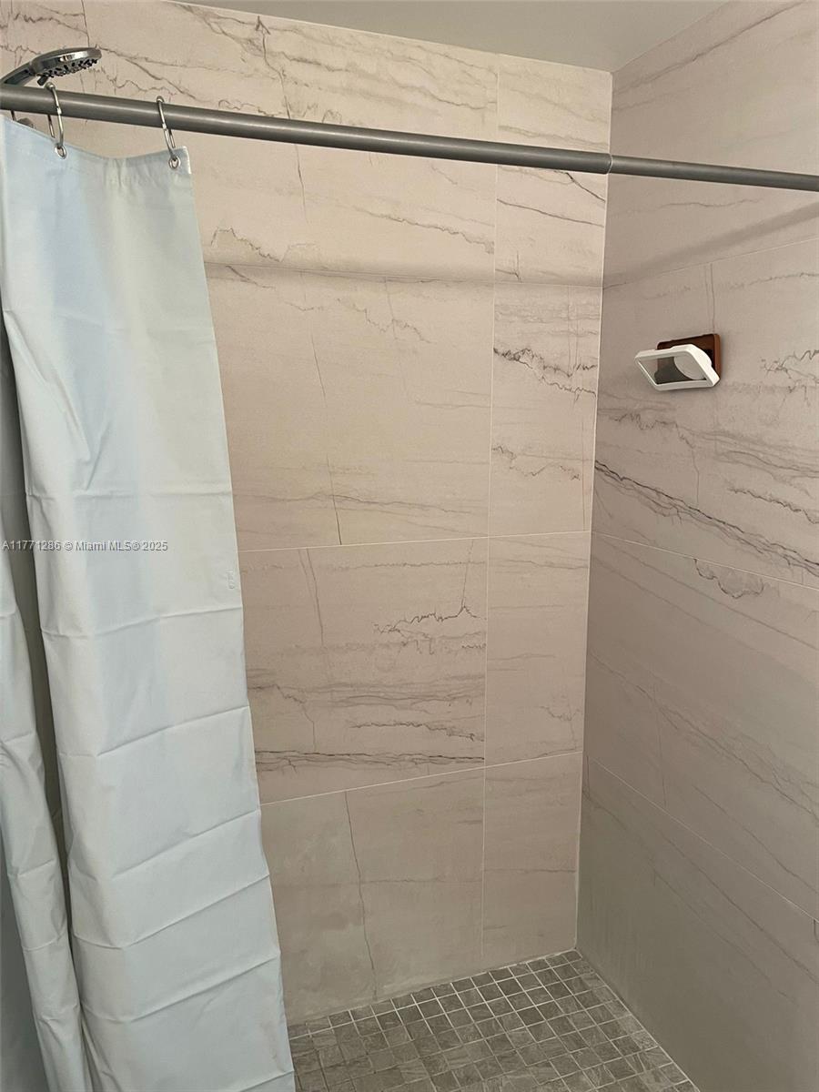 9 Whitehead Circle, Unit 9 Weston, FL 33326 - Photo 18 of 22 a bathroom with a shower