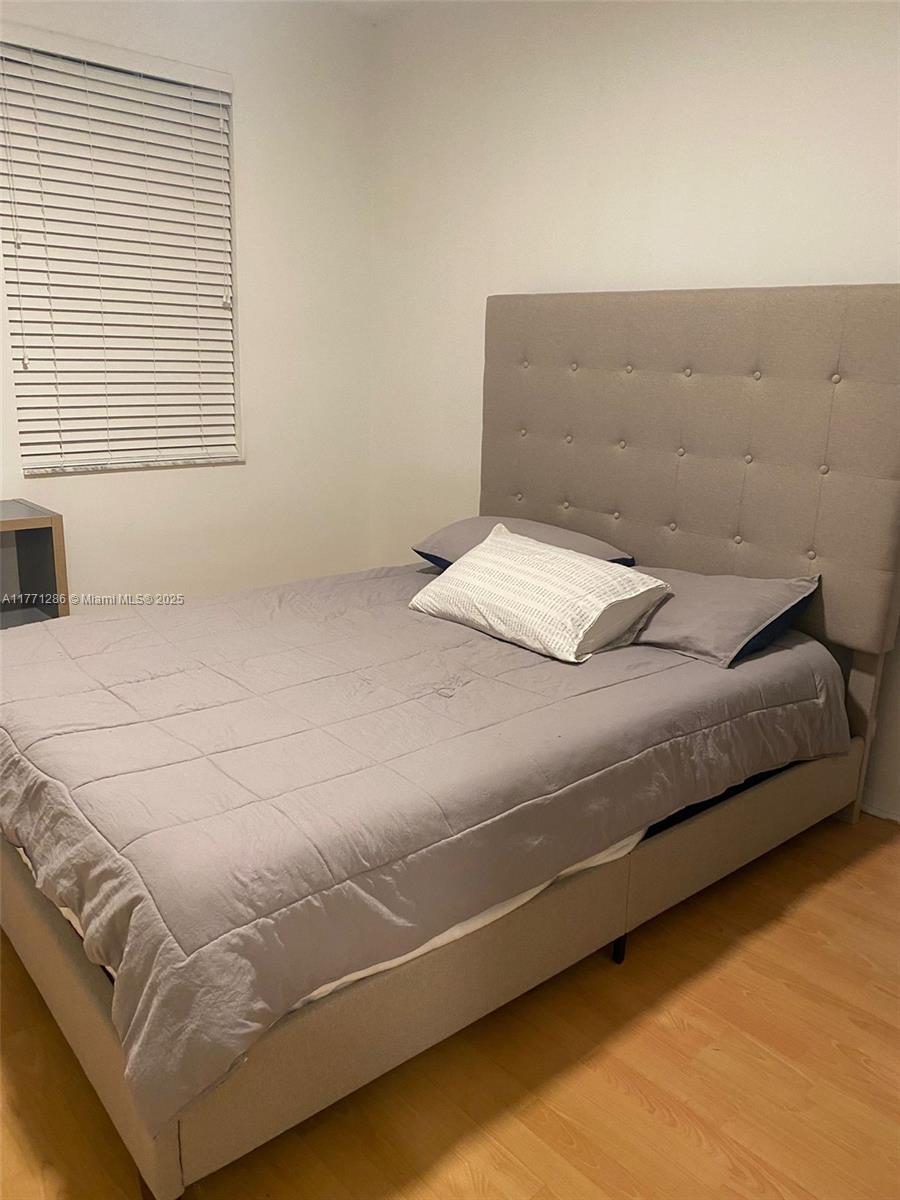 9 Whitehead Circle, Unit 9 Weston, FL 33326 - Photo 22 of 22 a bedroom with a bed and a window