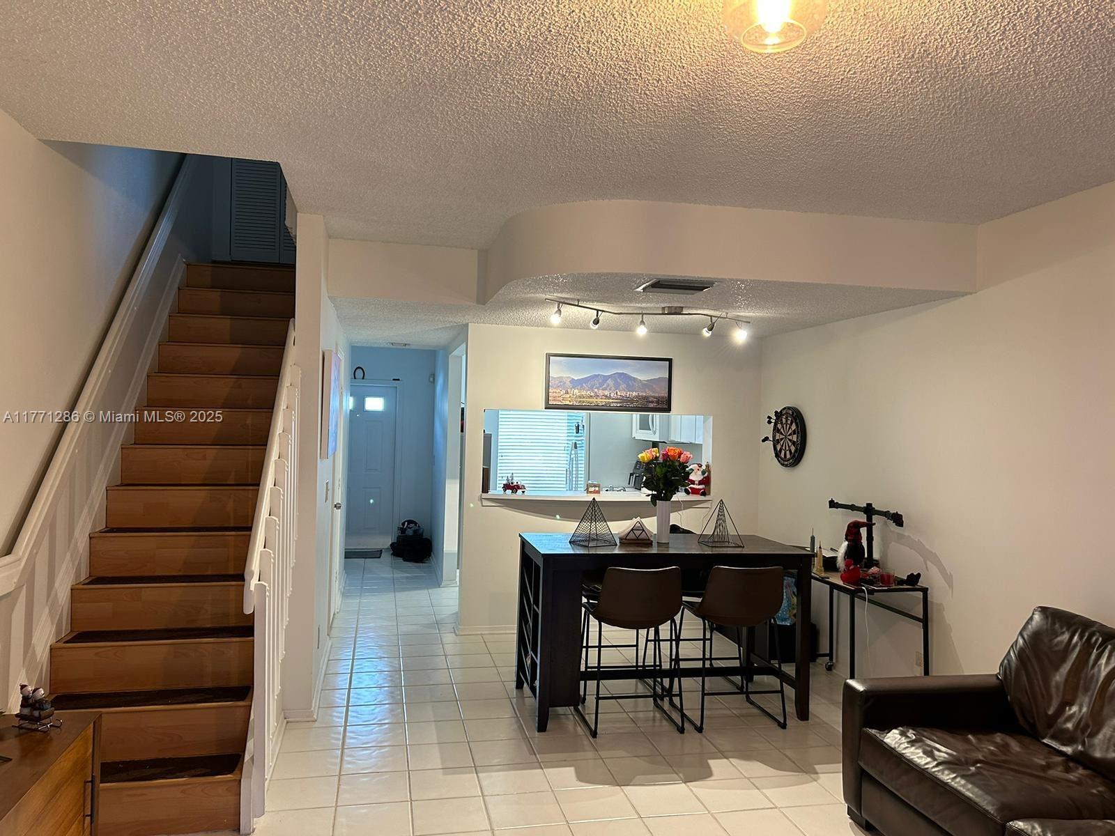 9 Whitehead Circle, Unit 9 Weston, FL 33326 - Photo 8 of 22 a view of a dining room with furniture