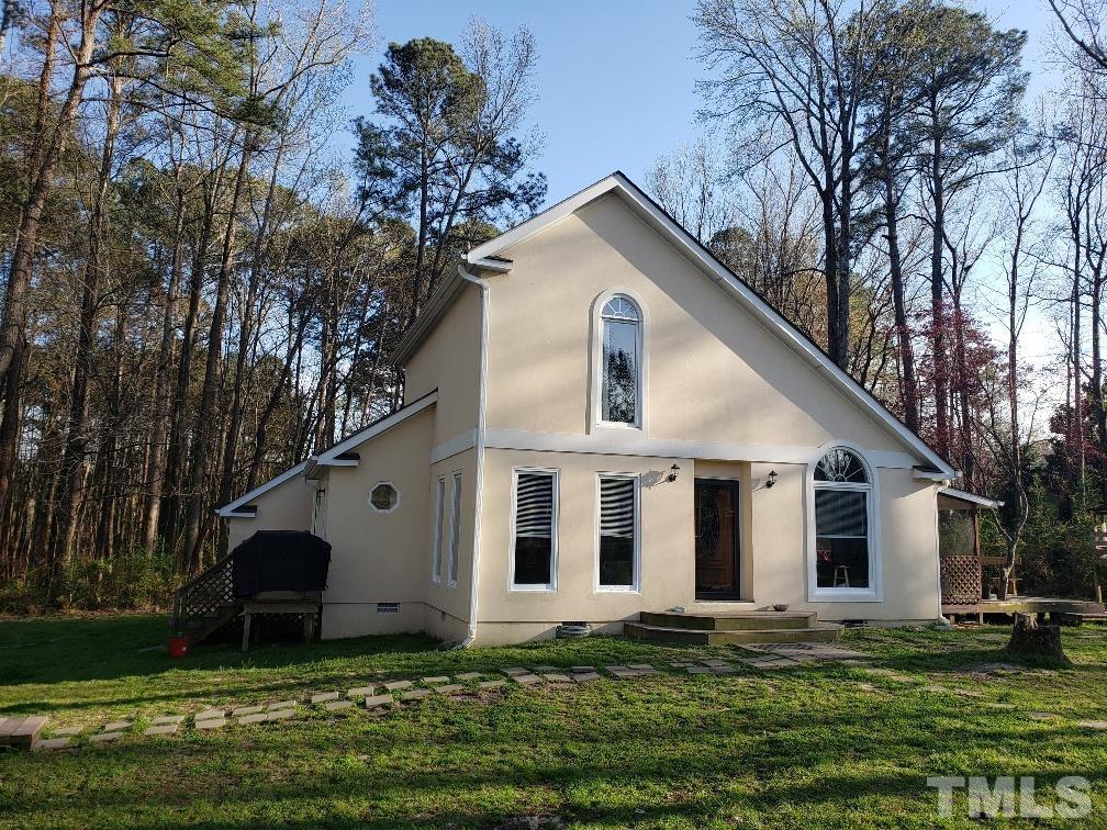 198 Pope Lake Road Angier, NC 27501 - Photo 1 of 19 a front view of a house with a yard