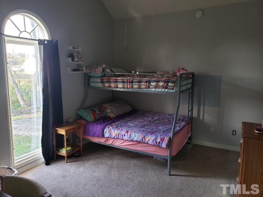 198 Pope Lake Road Angier, NC 27501 - Photo 15 of 19 a bed room with a bed and a window