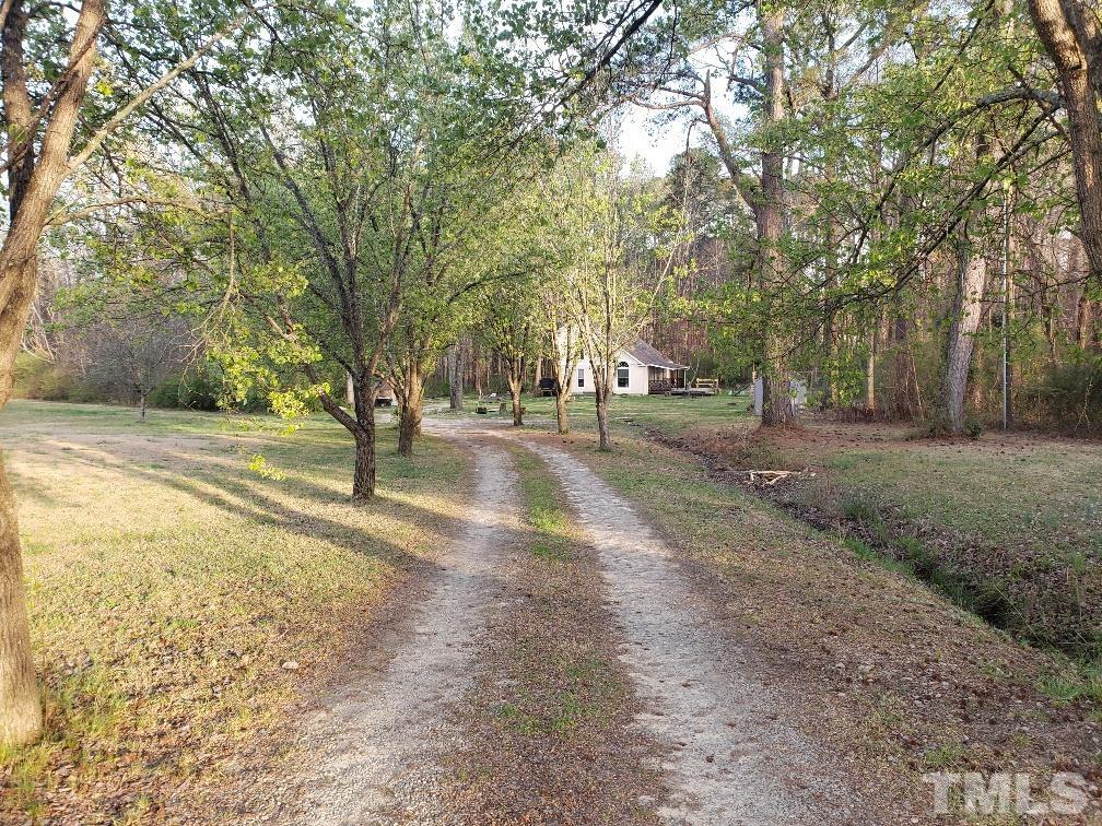 198 Pope Lake Road Angier, NC 27501 - Photo 2 of 19 a view of road with trees