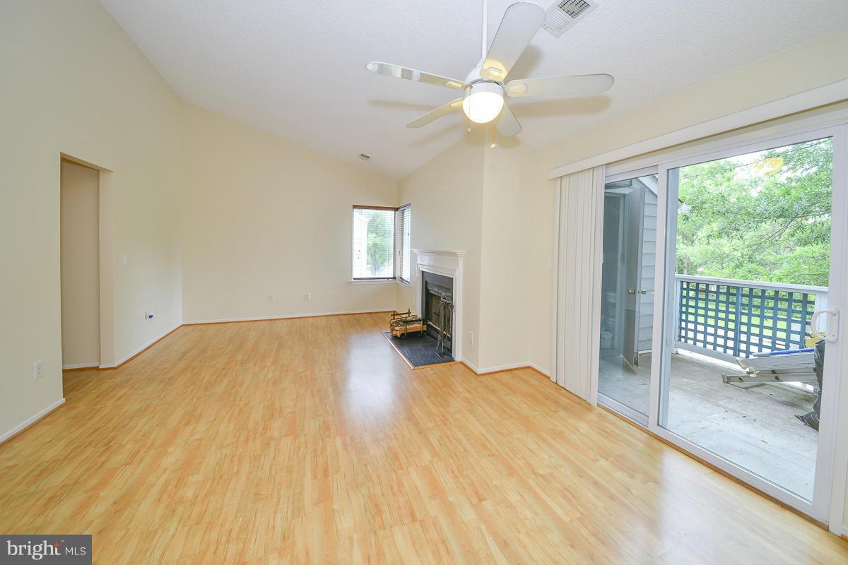 11743 Summerchase Circle, Unit B Reston, VA 20194 - Photo 2 of 24 a bedroom with a bed and a chandelier