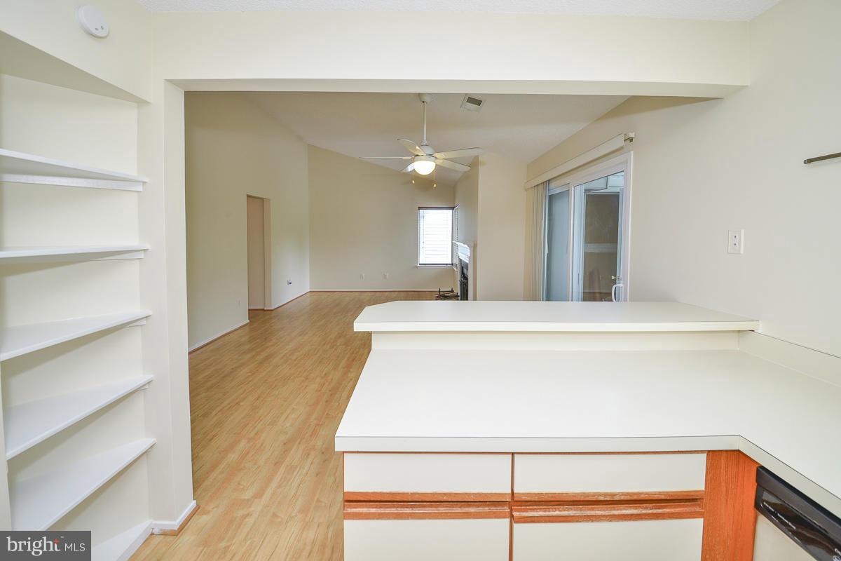 11743 Summerchase Circle, Unit B Reston, VA 20194 - Photo 11 of 24 a view of a hallway with a chandelier