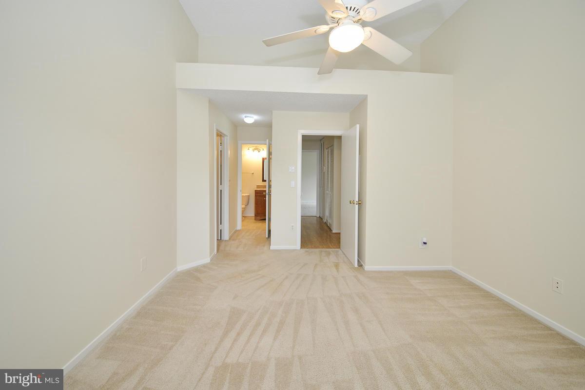 11743 Summerchase Circle, Unit B Reston, VA 20194 - Photo 12 of 24 a view of a room with a ceiling fan and a bathroom