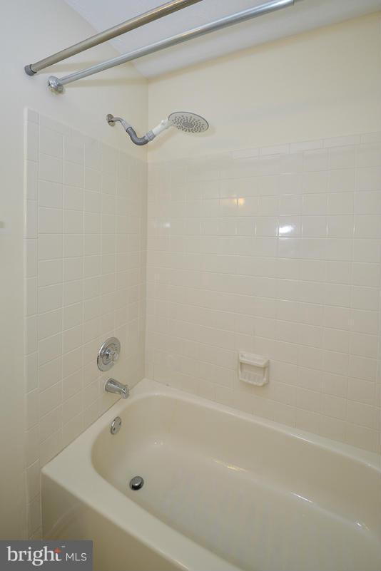 11743 Summerchase Circle, Unit B Reston, VA 20194 - Photo 15 of 24 a bathroom with a shower and a bath tub