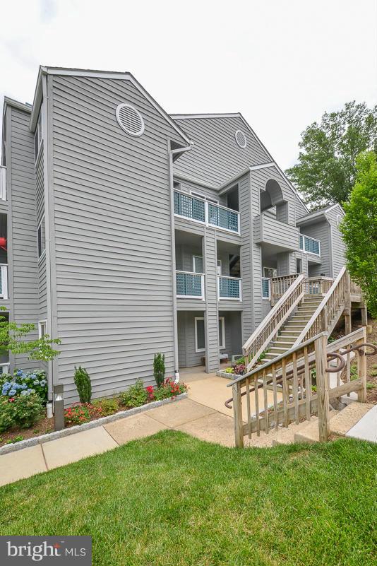 11743 Summerchase Circle, Unit B Reston, VA 20194 - Photo 24 of 24 a view of a house with a small yard and a large window