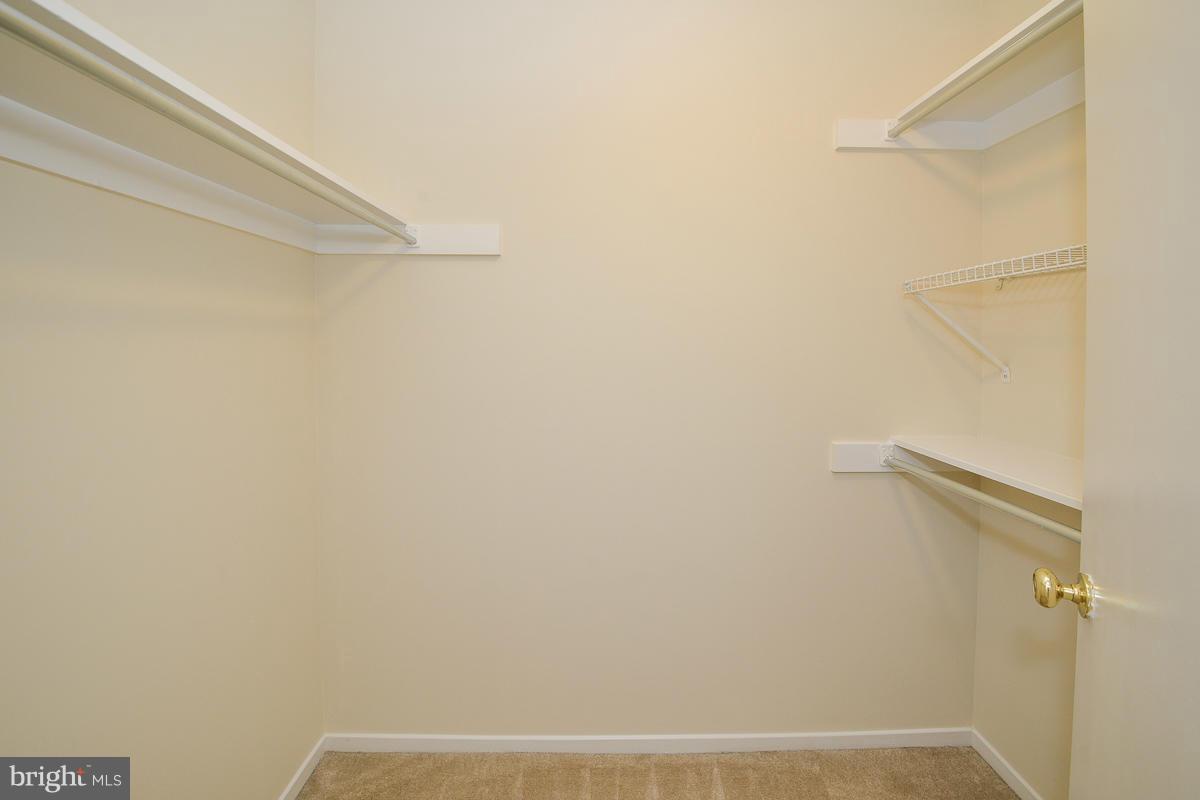 11743 Summerchase Circle, Unit B Reston, VA 20194 - Photo 6 of 24 a view of small space with racks on the wall