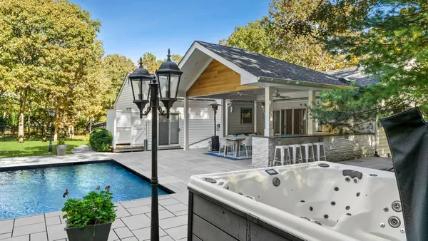 a view of roof deck with chair and table