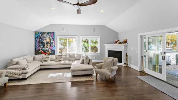 a living room with furniture or couch and a fireplace