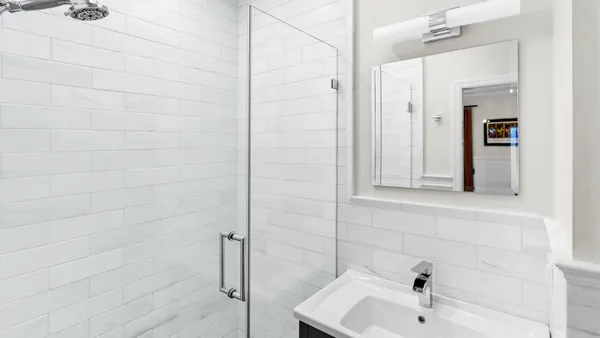 a bathroom with a sink and shower