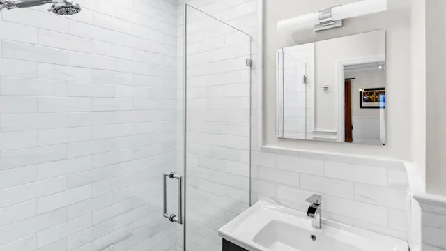 a bathroom with a sink and shower