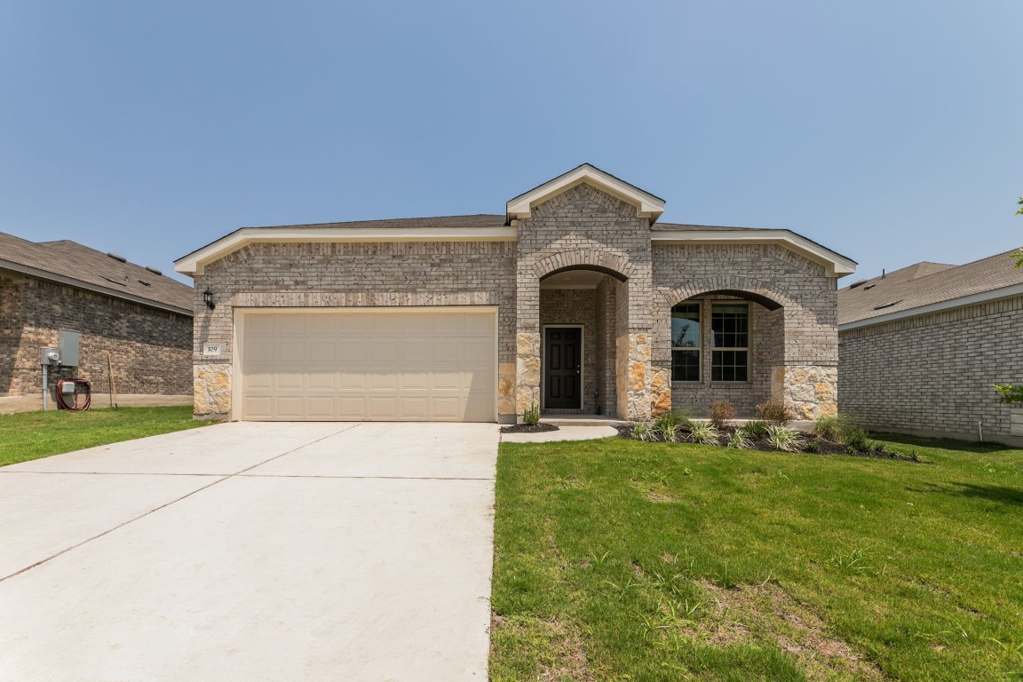 109 Pivot Drive Taylor, TX 76574 - Photo 1 of 1 a front view of a house with a yard